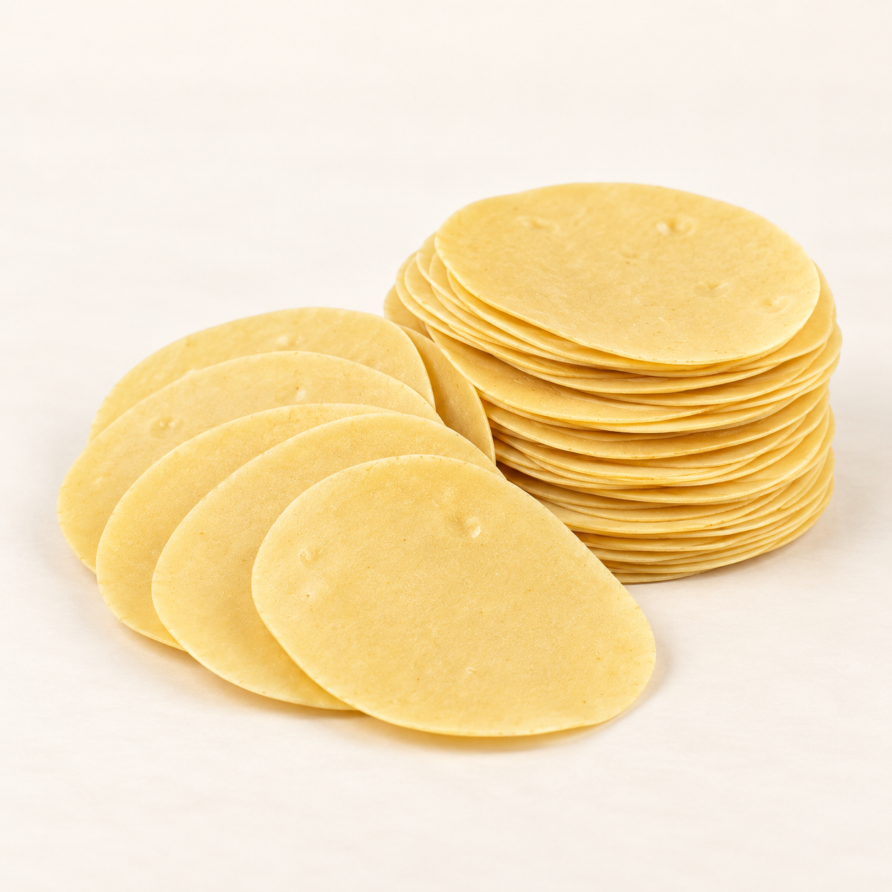 Jainam Mini Chorafali uncooked product on a clean ivory background
