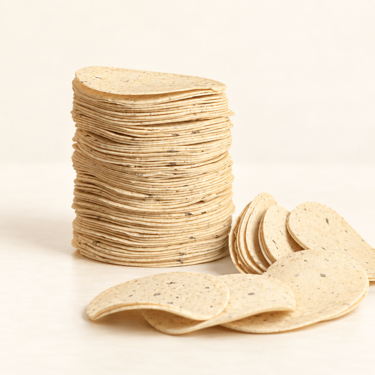 Jainam Mini Mathiya uncooked product on a clean ivory background